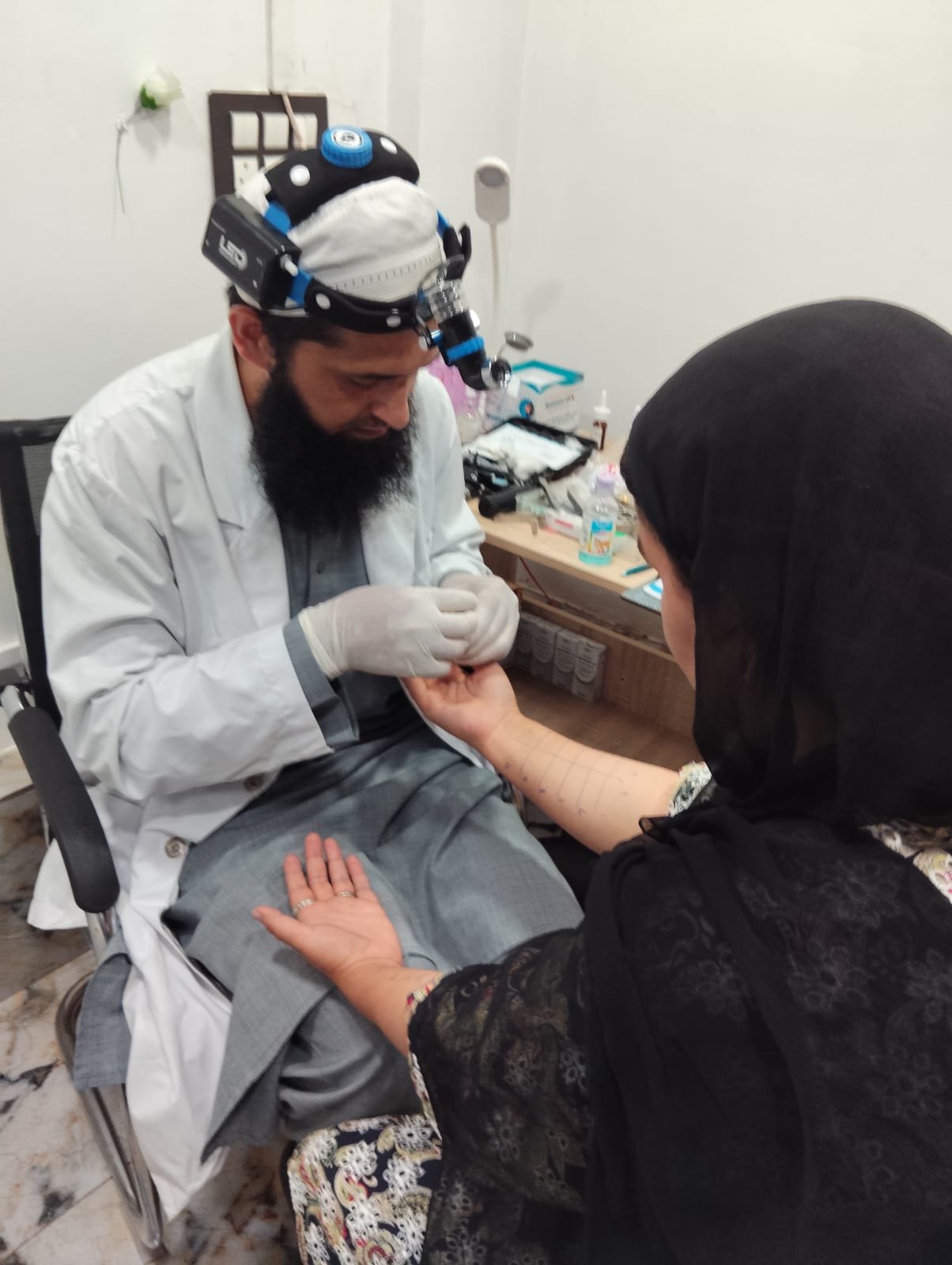 Doctor performing a skin prick allergy test on a patient's forearm at 360 Clinics.