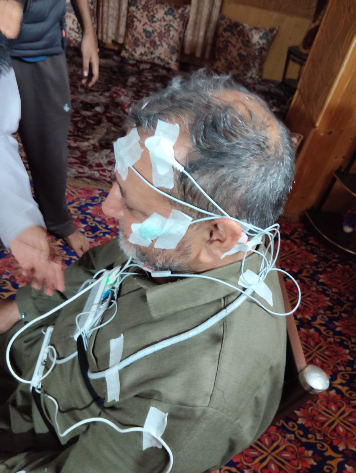 Patient wearing sleep study monitoring electrodes for an at-home sleep study at 360 Clinics.